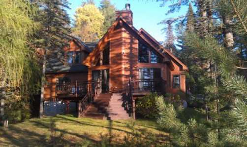 BEAUTIFUL WATERFRONT HOME WITH SANDY BEACH