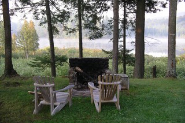 Outdoor fireplace and view of Horseshoe Pond
