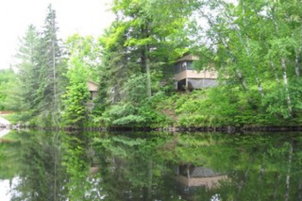 View of larger cabin, Balsam, from the lake.