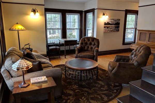 Parlor with antique piano and game table