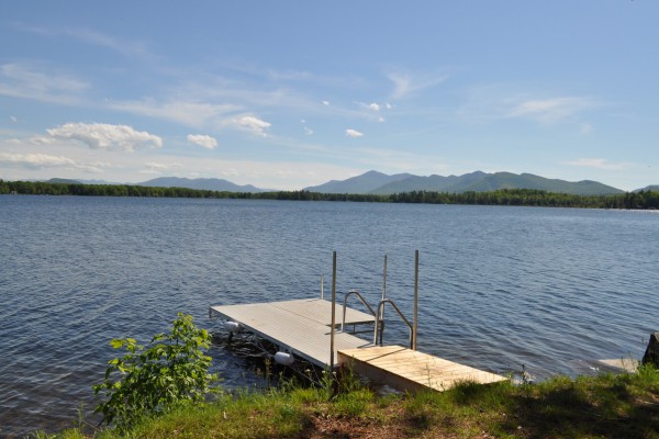 Dock with stairs into the clear, sandy lake floor