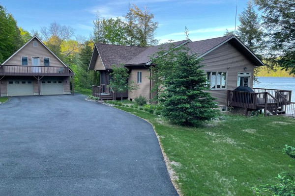 Main house, paved driveway and parking.