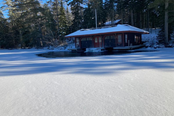 front of boathouse from frozen lake
