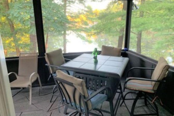 Screened porch overlooking the water