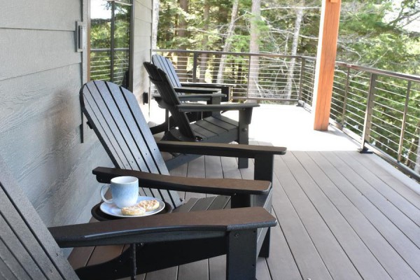 Porch with classic Adirondack chairs