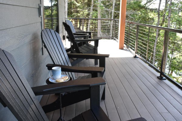 Lakefront porch and classic Adirondack chairs