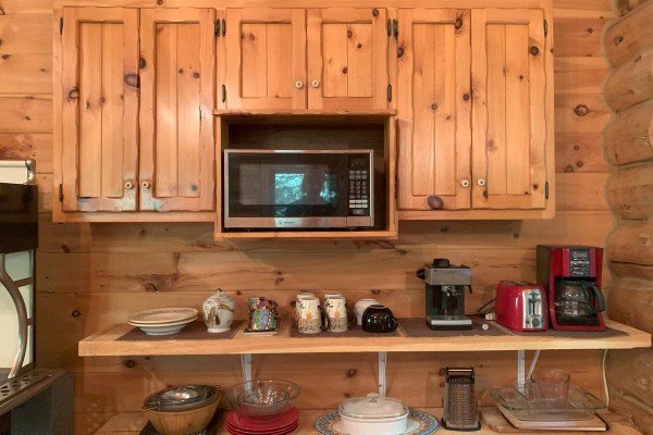 Details of the kitchen. Microwave, stove, utensils etc.