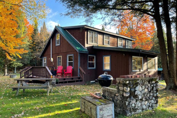 Cabin exterior, back deck and outdoor fireplace