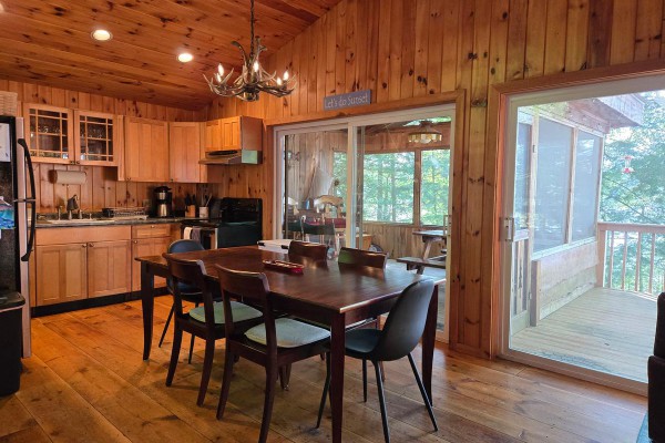 Full kitchen with sliders to deck and screen porch