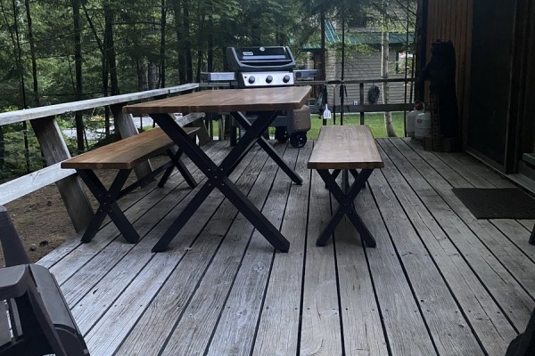 Large deck with grill and tables