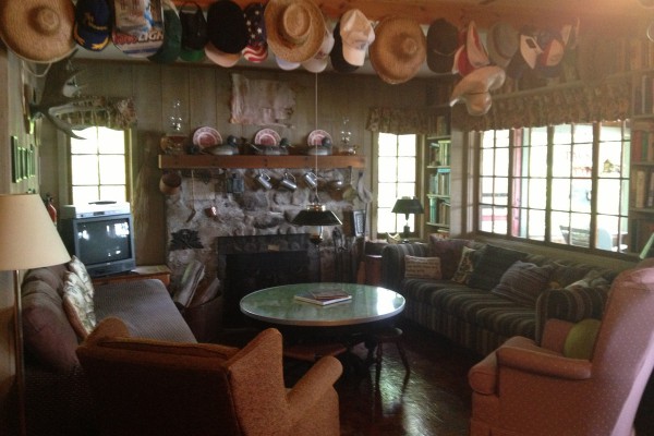 Living room with fireplace and adjoining dining room