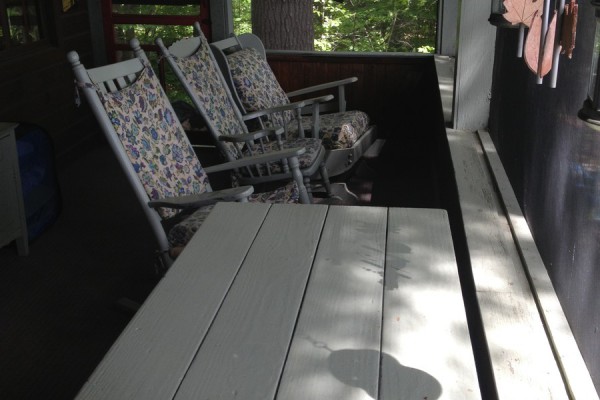 Rocking-chairs facing the lake & mountains on porch