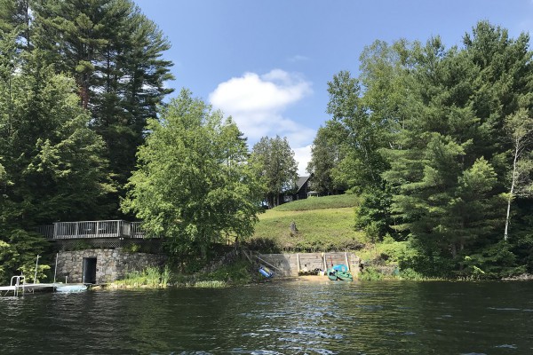 View of the beach, dock, boat house, deck and Lodge 