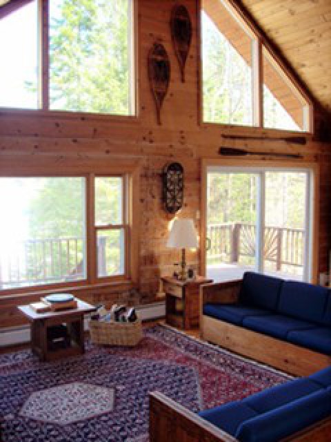 Great room with a wall of windows facing the lake