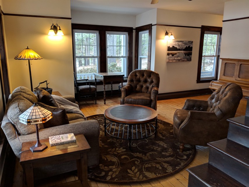 Parlor with antique piano and game table