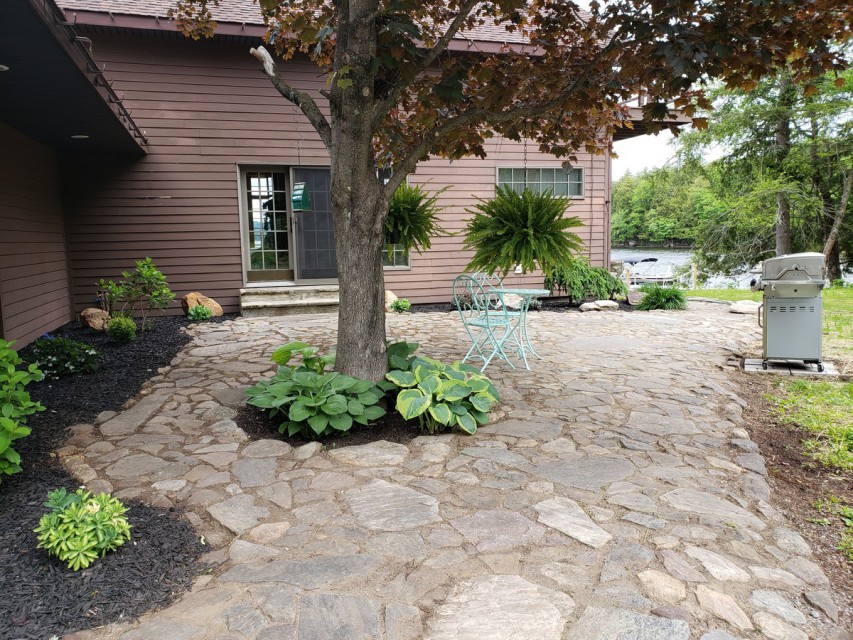 Back of house/patio area with gas grill, 1 acre of land