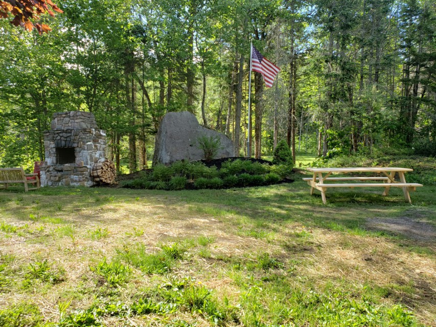 Side yard w/large fireplace and great views of the lake