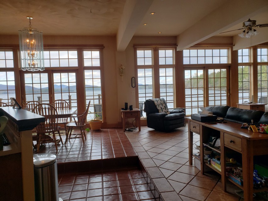 A wall of windows in main living area overlooking the l