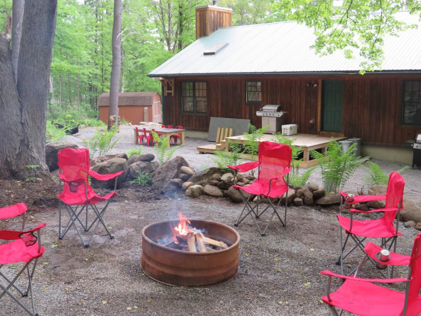 FIREPIT AREA AT REAR LOOKING TO REAR OF CABIN