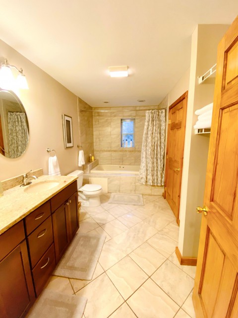Second floor jack and jill bathroom with jacuzzi