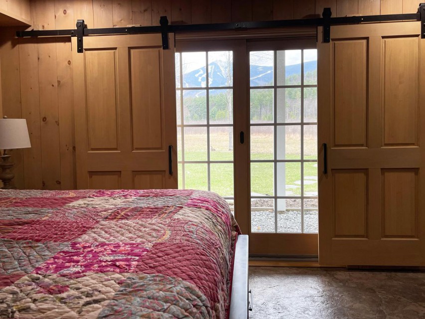 Main bedroom w/ bath on Lower Level. Views of Whiteface
