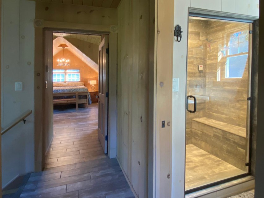 2nd floor bedroom, and large steam shower.