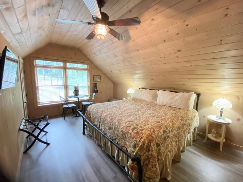 Carriage House Bedroom with ensuite and smart TV.