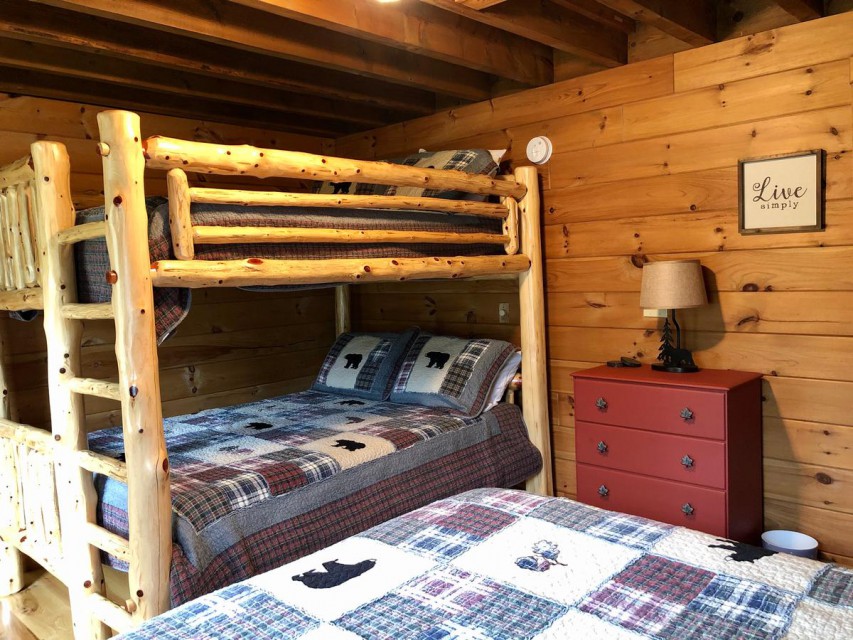 Bedroom with full bunk beds and additional queen bed