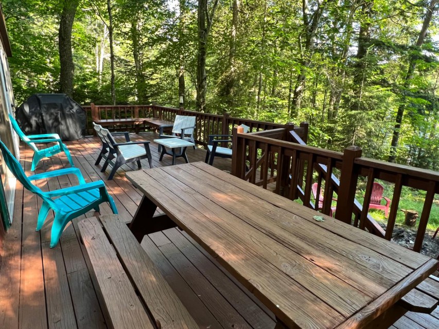 Enjoy the deck w/ lots of seating, a grill & lake views