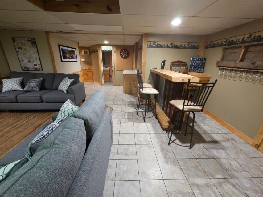 downstairs living room and bar with outside access