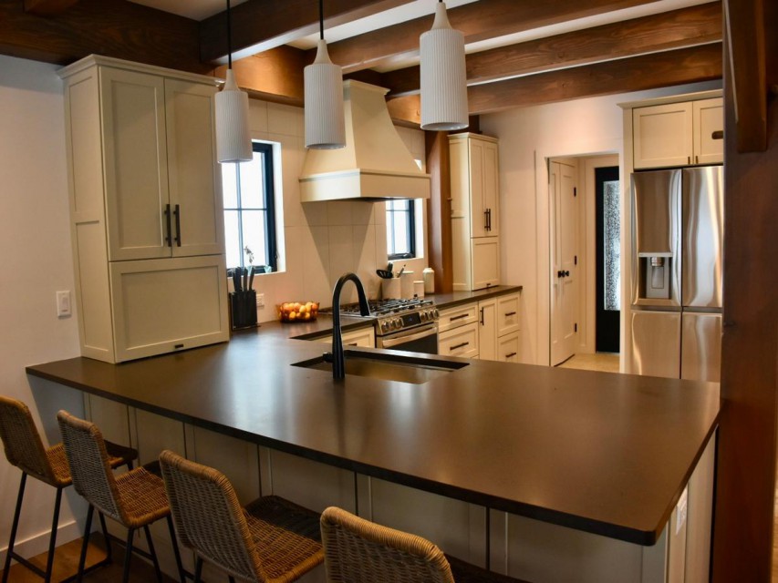 Spacious and well-stocked kitchen with bar seating