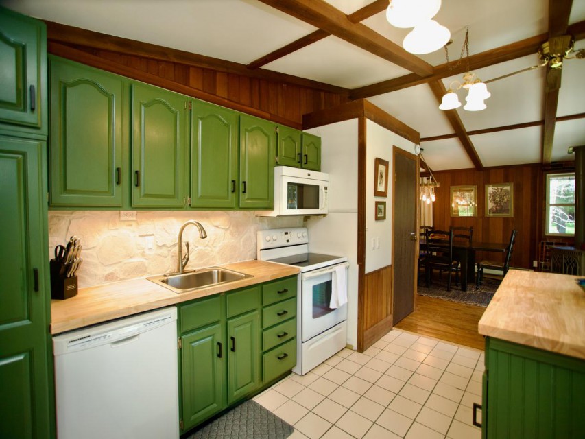 Kitchen with new appliances and a rolling island