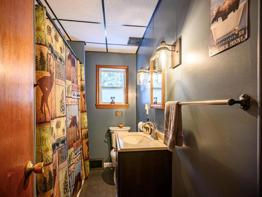 The down stairs bathroom with tub and shower