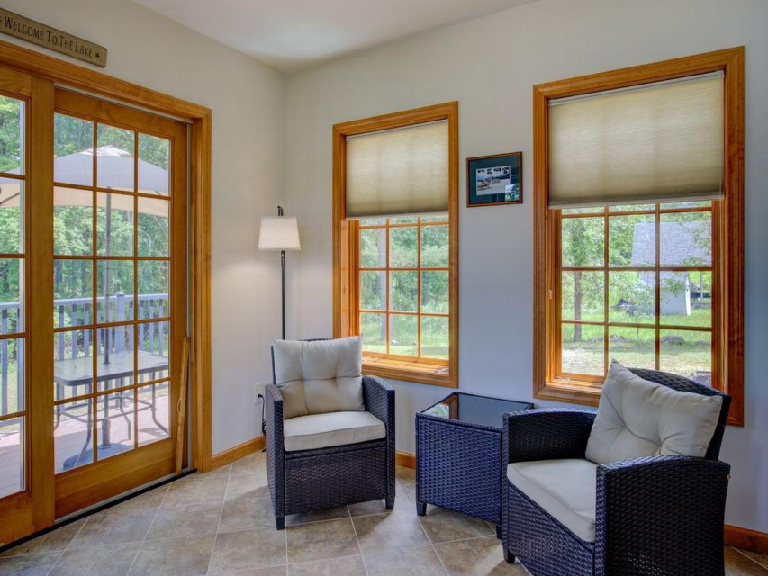 sunporch with door to back deck & dining area