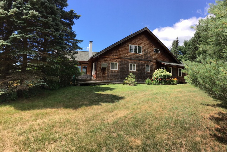 The front of the house from the blueberry row.