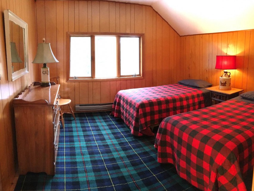 Second floor bedroom with two twin beds. 