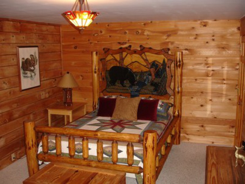 Master bedroom with hand-carved bear bed