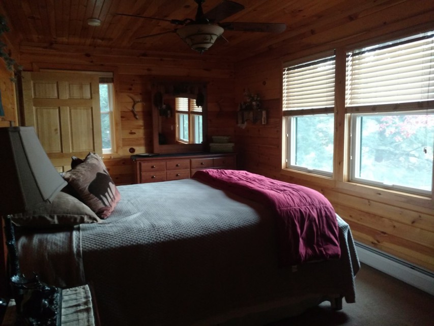Two lake side bedrooms with queen beds.