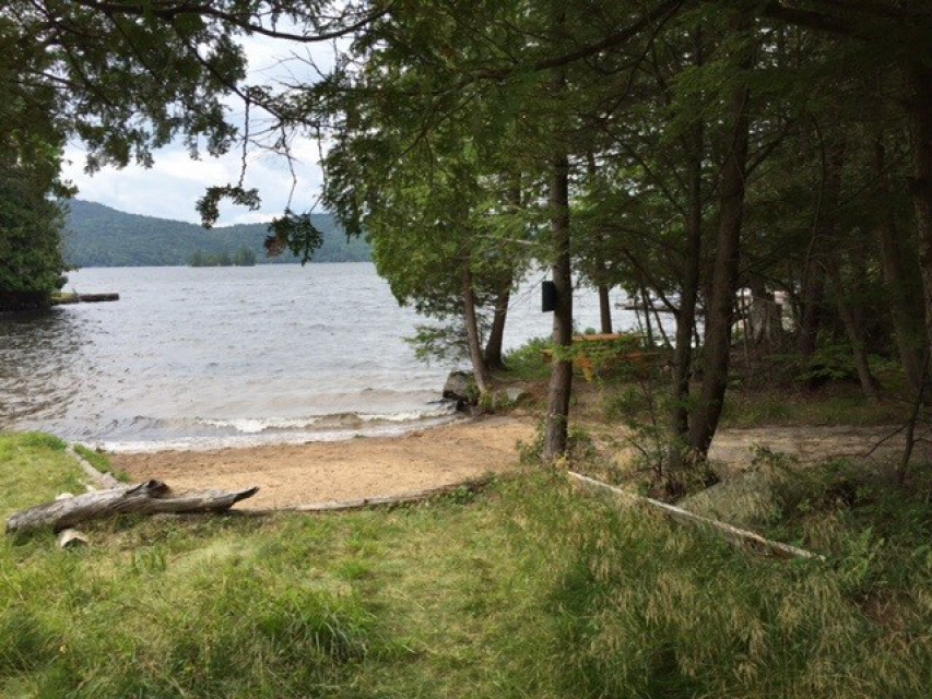 Shallow sandy beach  a short walk  from Camp