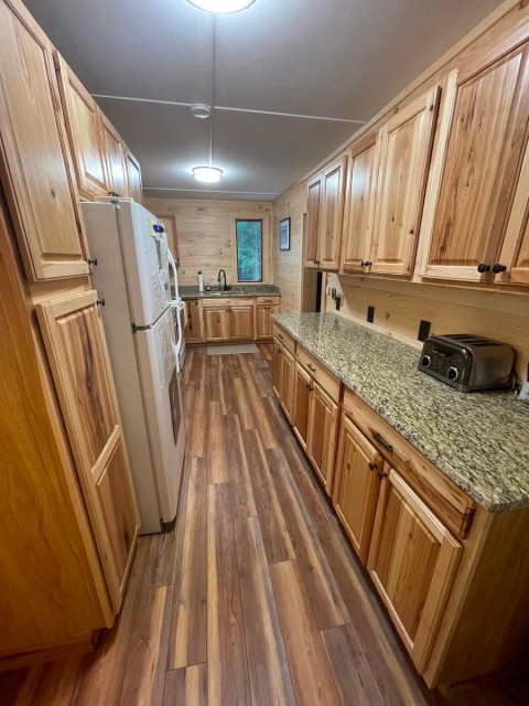 Full kitchen - oven, microwave, fridge, water dispenser
