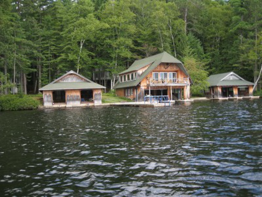 Boathouse sits in between two smaller boathouses