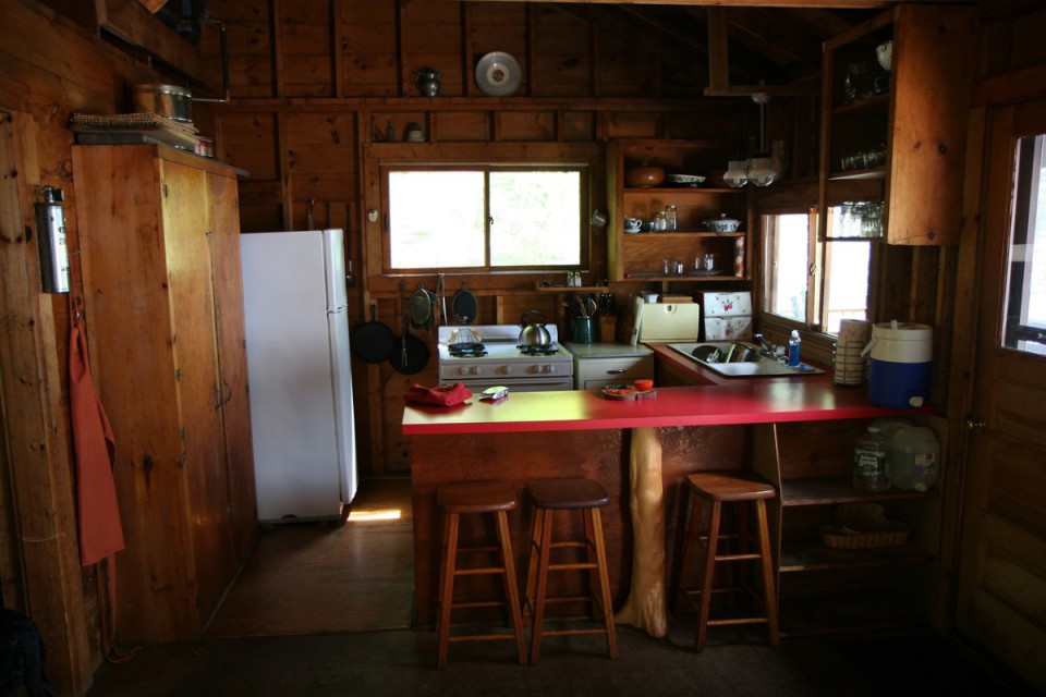 Kitchen and counter with stools.