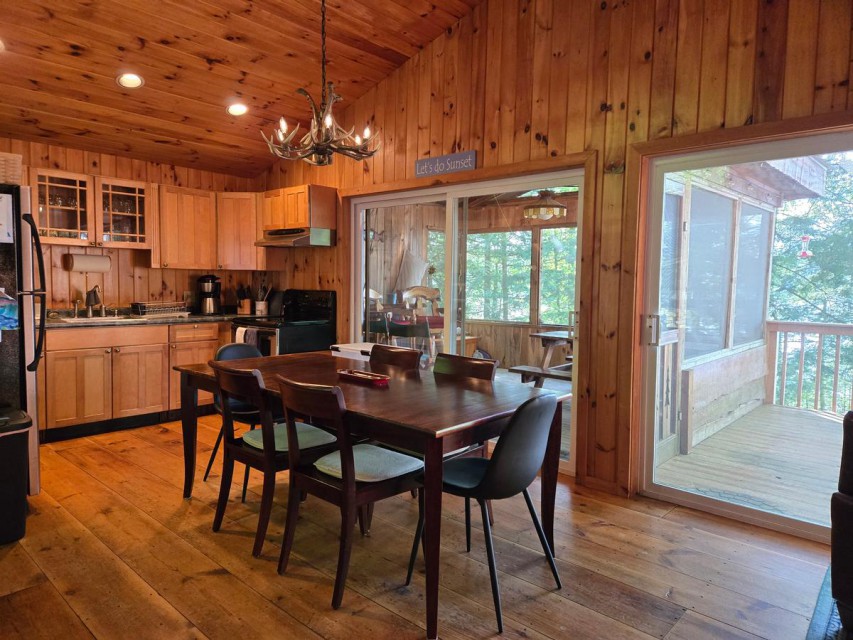 Full kitchen with sliders to deck and screen porch