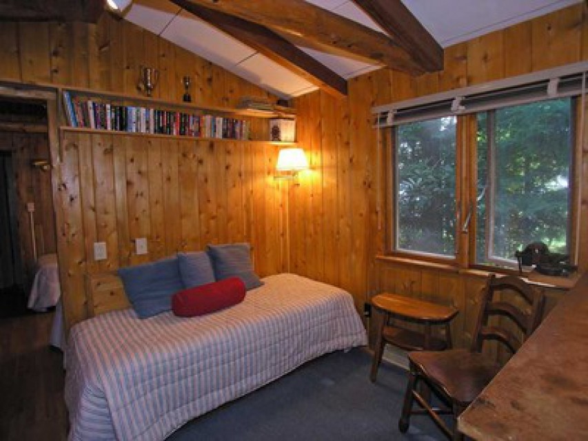 One bedroom with 2 single beds & den with bunk bed