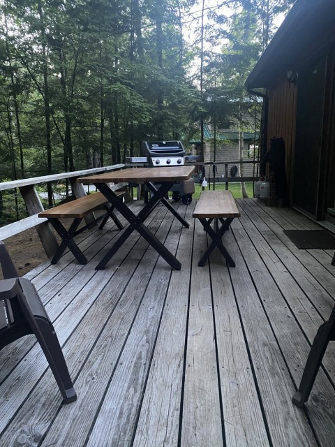 Large deck with grill and tables