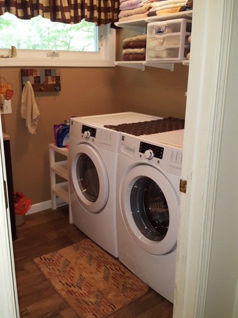 Upstairs full bath with laundry.