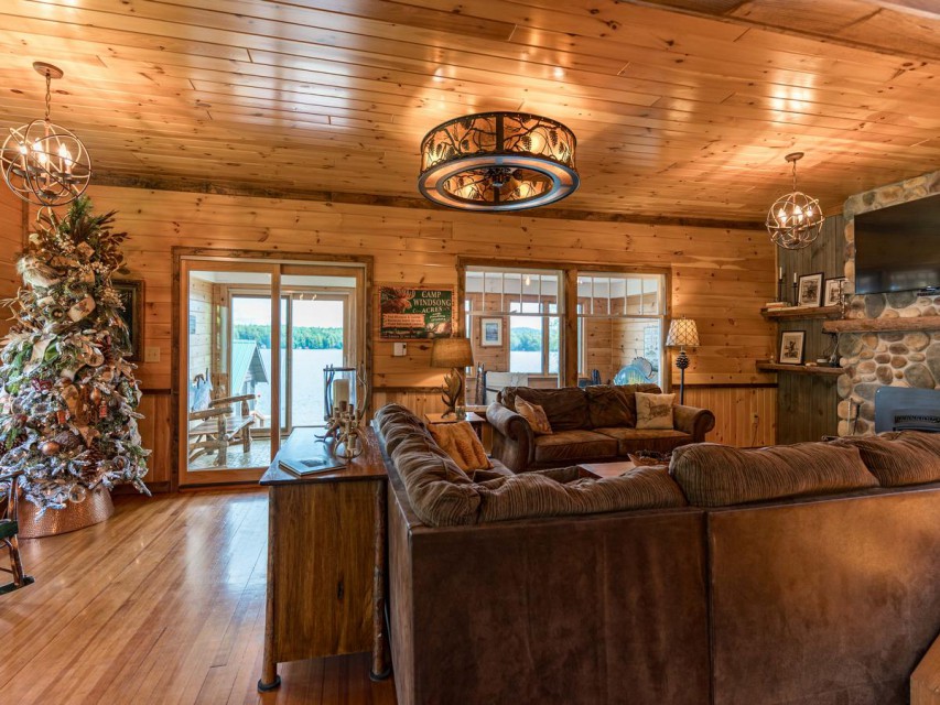 Living room w/sectional seating, sofa, and fireplace.
