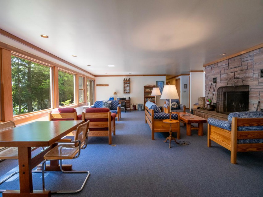 Downstairs living room with fireplace and lake views