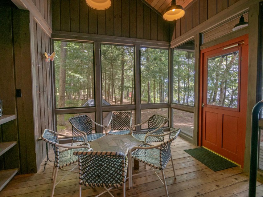 Screened porch with path to boathouse