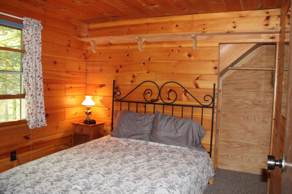 Apartment bedroom with queen bed